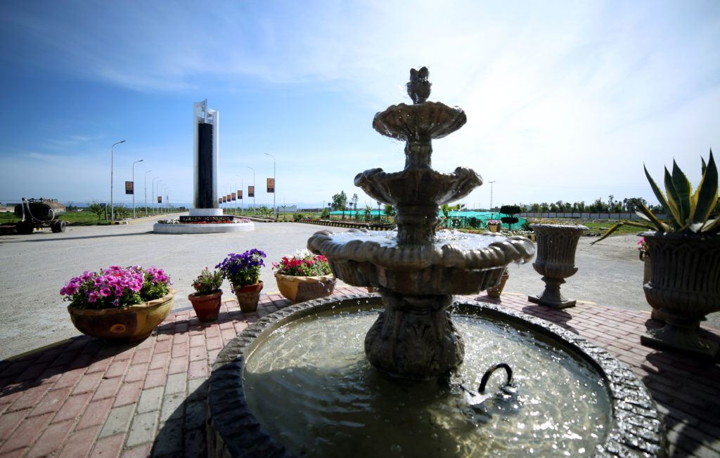 A fountain in front of the boulevard monument