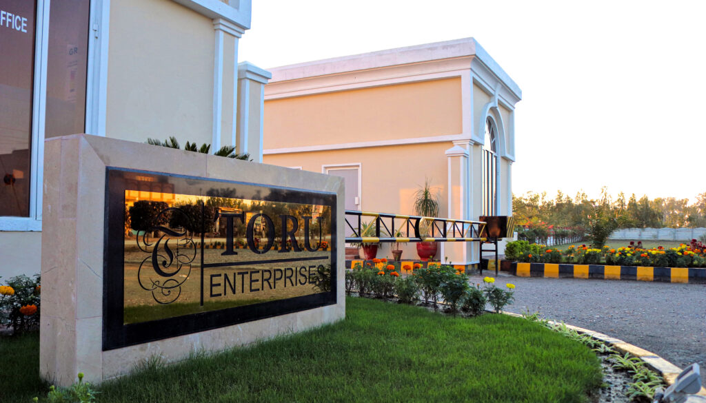 The Toru Enterprises sign at the Green Mansions entrance