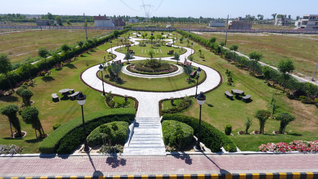 Aerial view of a park with a central fountain and symmetrical paths