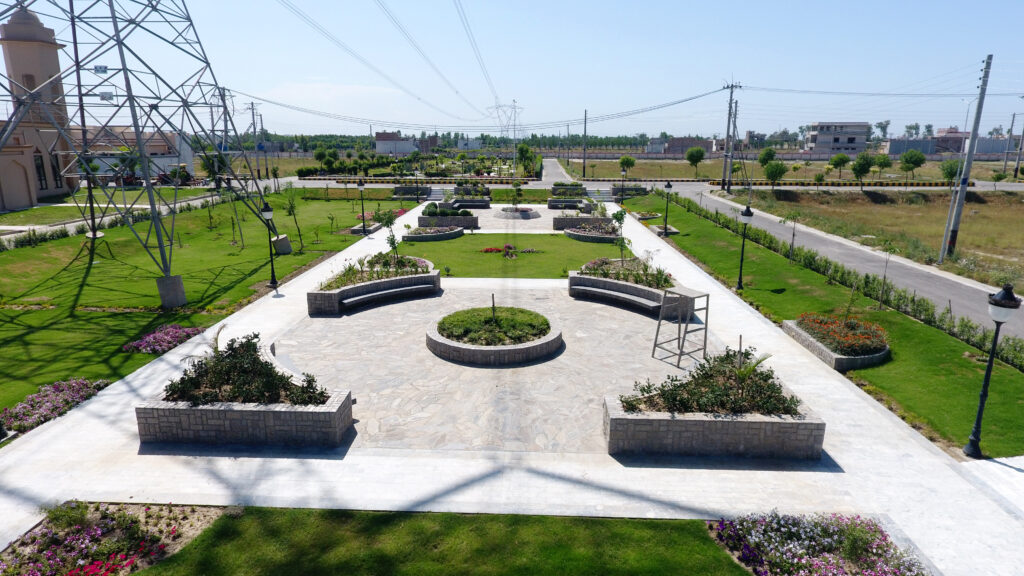 A landscaped park with planters and paved paths